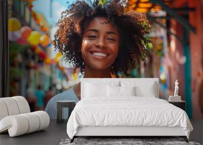 A cheerful young woman in casual clothes beams with joy as she enjoys a colorful and lively outdoor market with vibrant decorations and diverse stalls around her. Wall mural