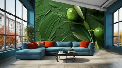 A close-up of green olives with leaves on a textured, green background, showcasing a fresh and organic feel. Wall mural