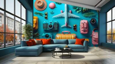 A collection of essential travel items, including suitcases, airplane models, cameras, hats, and sunglasses, displayed against a vibrant blue background for an adventurous spirit. Wall mural