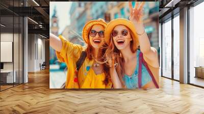 Two joyful young women in summer attire giving a peace sign on a city street, exuding happiness and friendship Wall mural