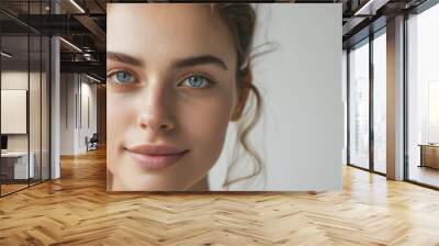 Close-Up Portrait of Young Woman with Blue Eyes and Natural Makeup in Soft Lighting - Beauty, Skincare, and Wellness Concept Wall mural