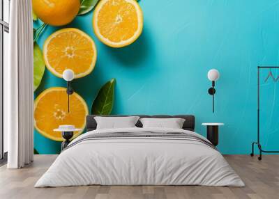 Fresh Orange Slices with Green Leaves on a Vibrant Blue Background - High-Quality Food Photography for Summer, Vitamin C, and Refreshing Citrus Concepts Wall mural