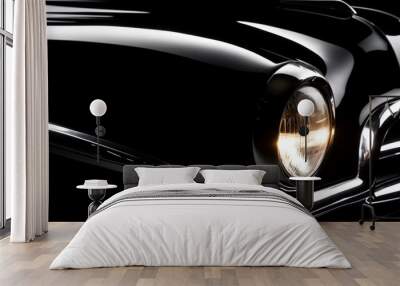 Sleek Black Vintage Car Close-Up with Glowing Headlight at Night. Wall mural