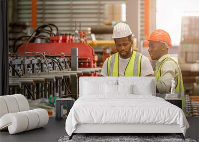 African black people worker working together asist new young employee teamwork in metal factory. Wall mural