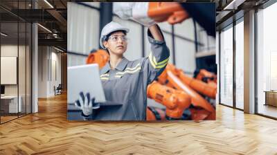 engineer woman working in advance machine factory. indian female engineering staff work checking rob Wall mural