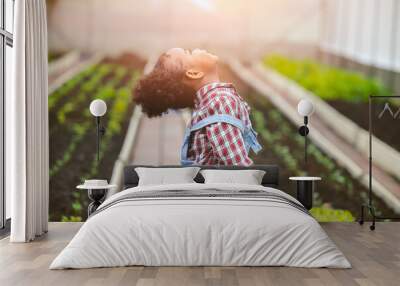 happiness child little girl enjoy happy play as farmer plant the tree in vegetables garden farm Wall mural