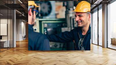 happy worker, smiling industrial technician engineer enjoy working together with coworker. Wall mural