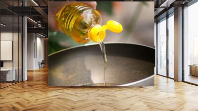 pouring food oil in hot pan for deep frying. Wall mural