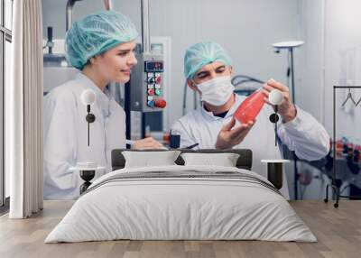 Quality control and food safety inspector test and check product contaminate standard in the food and drink factory production line with hygiene care. Wall mural