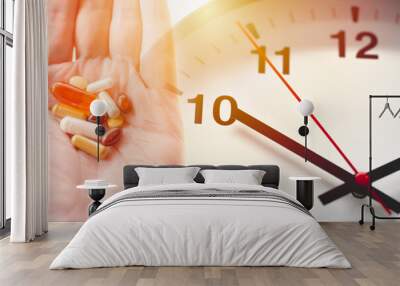 Time of day to take a drug multi-dose medication concept. various assorted medicine pills tablet overlay clock face. Wall mural