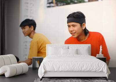 Confidence Two Young Asian Man Playing Ping Pong Match Together Wall mural