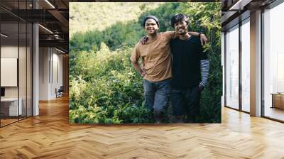 Young Asian hiker men standing together and smiling at camera outdoor Wall mural