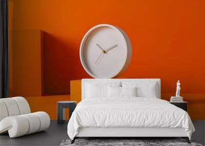 A modern white clock with clear markings, placed on a striking orange background, vividly captured Wall mural