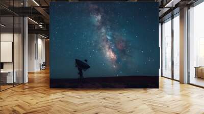 Milky Way galaxy stretching across the night sky above the Very Large Array satellite dish in New Mexico, with the dish silhouetted against the cosmic backdrop Wall mural