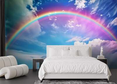 Stunning view of a double rainbow with bright, distinct colors appearing in the sky following a passing storm, framed by a clear and dramatic atmosphere Wall mural