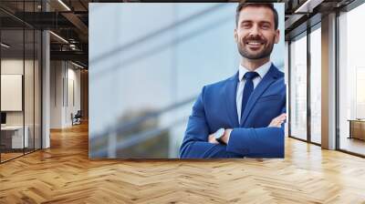 portrait of businessman smiling with confident at outdoor modern building Wall mural