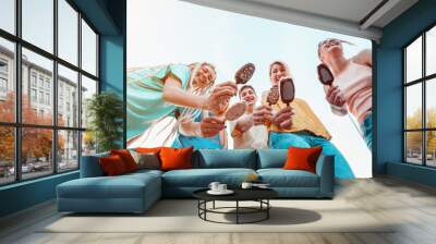 Group of young people eating ice cream and smiling Wall mural