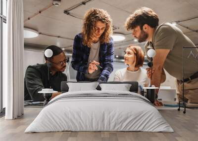 Front view photo of diverse business partners discussing financial graph charts and new business ideas at modern office meeting room Wall mural