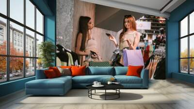 Two girls in a fashion store Wall mural