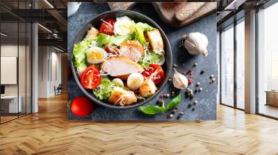 Classic caesar salad with chicken fillet and parmesan cheese. Top view, copy space. Wall mural