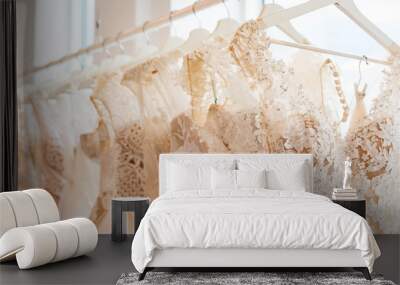 wedding dresses hanging on racks Wall mural