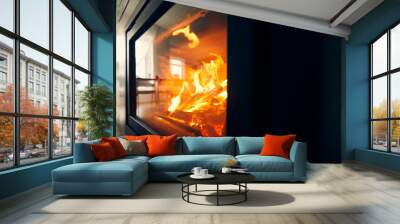 A fire burns in a fireplace, Fire to keep warm. Logs burning in a fireplace Wall mural