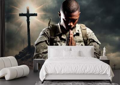 Christian soldier praying with cross in the background. Wall mural