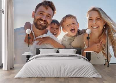 happy family, portrait and beach with happy, smile and relax mother and father hug, embrace and laug Wall mural