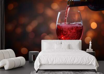 Red wine being poured into a glass, sparkling bubbles and warm bokeh background, symbolizing celebration and fine dining Wall mural