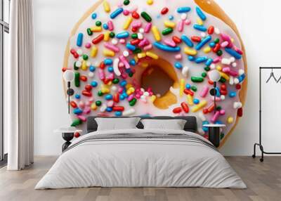 Delicious donut with colorful sprinkles seen from the top on white background. Wall mural