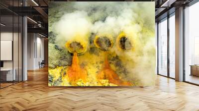 molten sulfur dripping from pipes at kawah ijen volcano, east java, indonesia. Wall mural