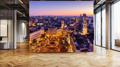 Sightseeing of Spain. Aerial view of Valencia at sunset. Illuminated Plaza de la Reina, cityscape of Valencia. Wall mural