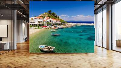 The picturesque village of Kokkari with traditional houses and fishing boats. Kokkari village is a popular tourist place on the island of Samos. Wall mural