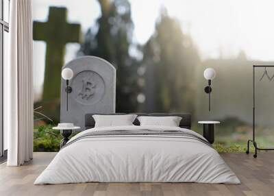 stone monument/tombstone with bitcoin symbol on cementery - sunny blurred background with space for text - economic/financial concept Wall mural