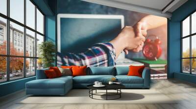 The hands of business people are willing to invest in business together in the office. Wall mural