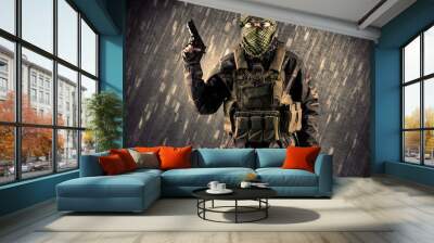 Armed terrorist man with mask on rainy background Wall mural