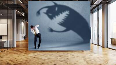 Business man afraid of his own shadow monster concept Wall mural