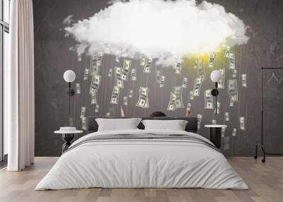 Business man in suit looking at cloud with falling money Wall mural