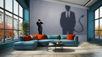 business man looking at his own devil demon shadow concept Wall mural