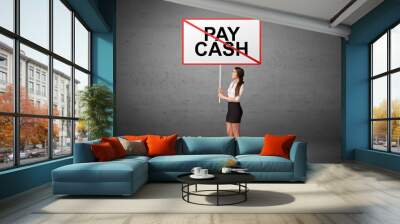 business person holding a traffic sign with PAY CASH inscription, new idea concept Wall mural