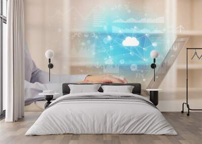 Business woman in homey environment using laptop with cloud technology concept Wall mural