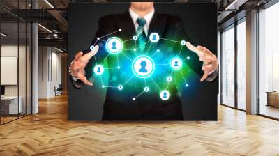 Businessman holding social media network Wall mural