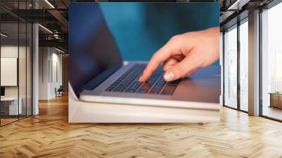 Businessman pressing modern laptop computer on colorful backgrou Wall mural