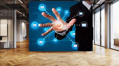 Businessman pressing virtual messaging type of icons Wall mural