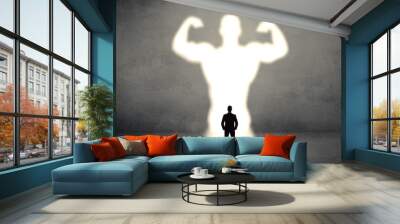 Businessman standing and dreaming about a strong superhero Wall mural