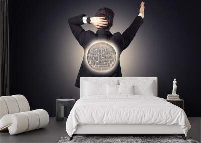 Businessman standing with maze on his back Wall mural