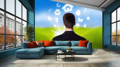 businessman with eco icons floating around his head 2 Wall mural