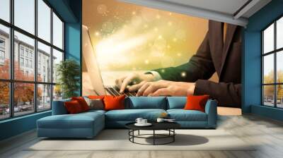 Businessman working fast on laptop Wall mural