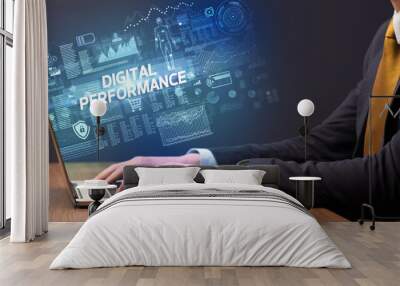 Businessman working on laptop with DIGITAL PERFORMANCE inscription, cyber technology concept Wall mural