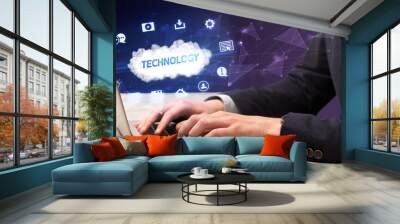 Businessman working on laptop with TECHNOLOGY inscription, modern technology concept Wall mural